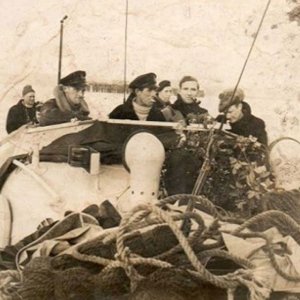 B. Thomas (2nd right with pipe)