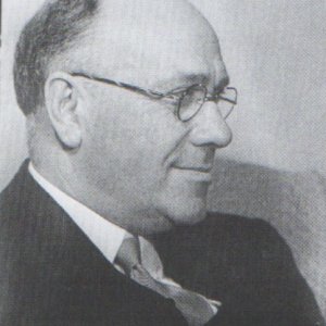 E. Travis